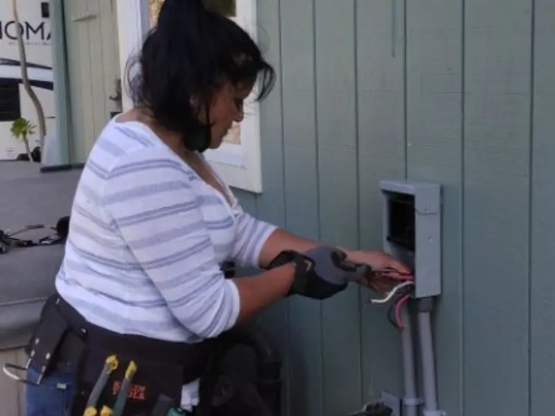 Licensed electrician wiring an exterior subpanel in Rexland Acres