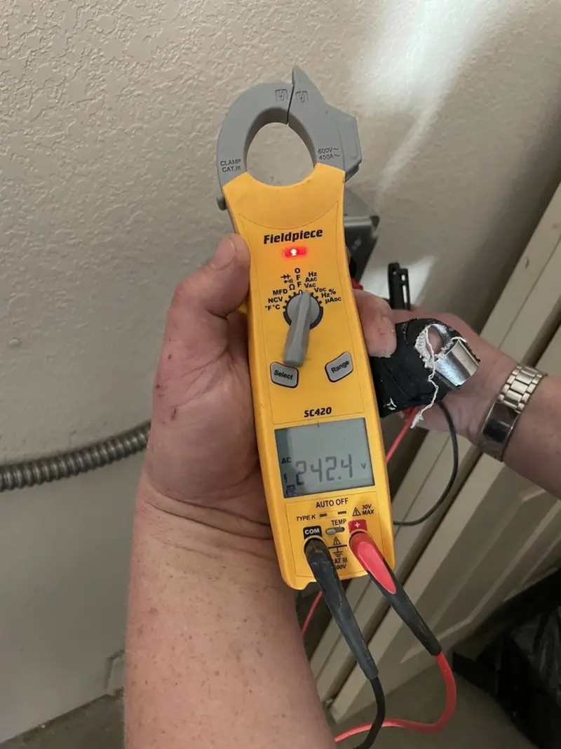 Voltage testing with clamp meter during Generator Installation in Rexland Acres